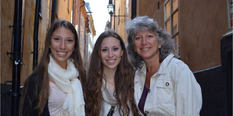 Sue Novak and her two daughters in Sweden.