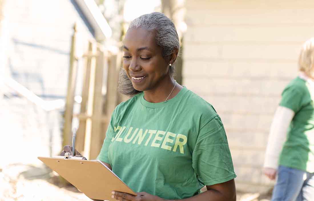 Photo of a nonprofit worker holding a clipboard.