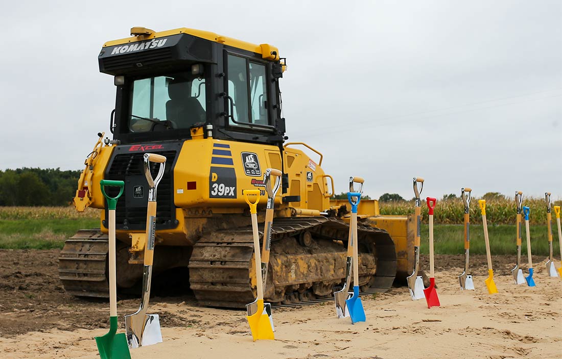 Photo of construction equipment and shovels at the celebration for Caledonia Community Schools Dutton Elementary groundbreaking
