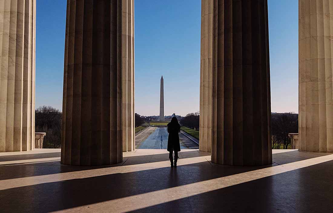 Single person looking at Washington Monument.