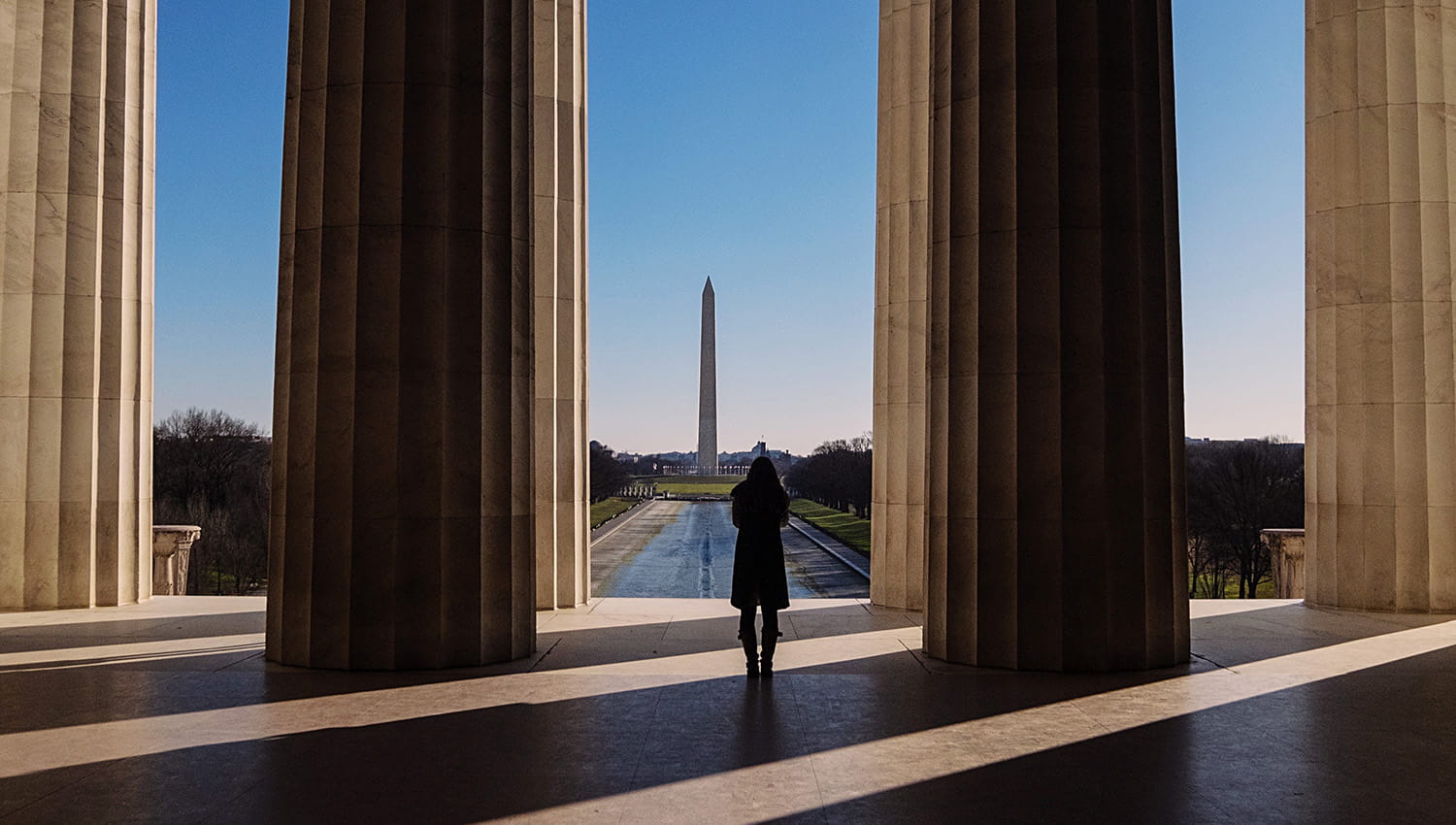Single person looking at Washington Monument