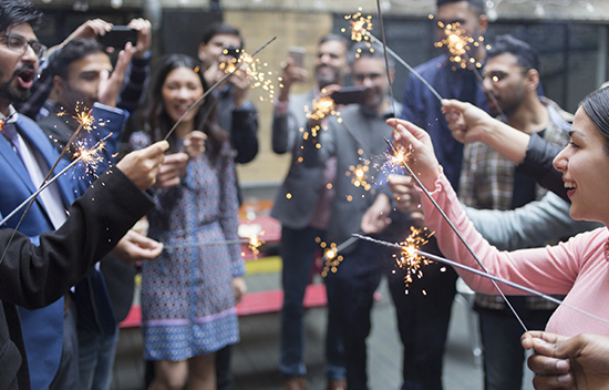 People holding sparklers and celebrating