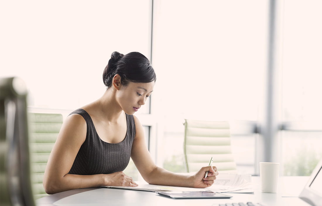 Image of woman working at a desk