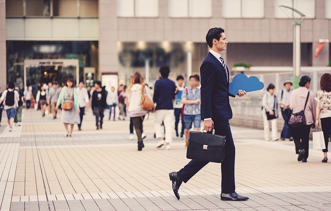 Image of a business man walking outside