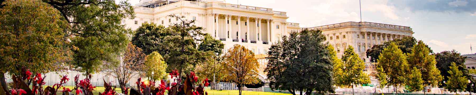 View of the U.S. capitol building with the sun shining on it.