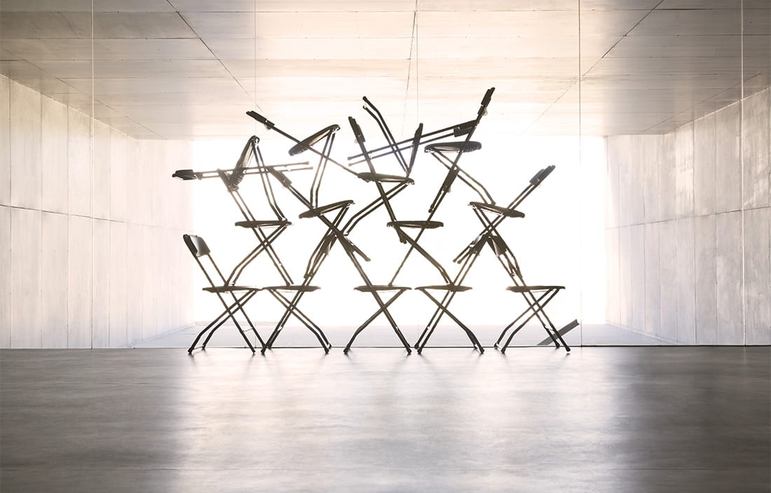 Image of chairs stacked on top of each other