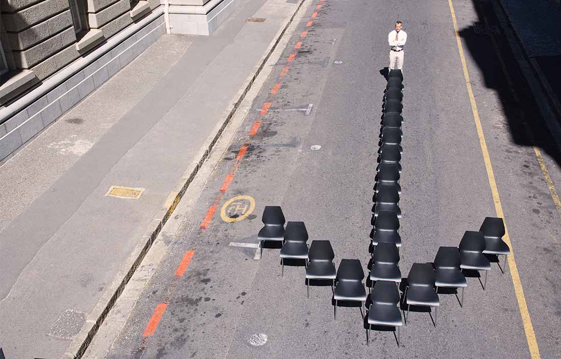 image of chairs arranged as an arrow