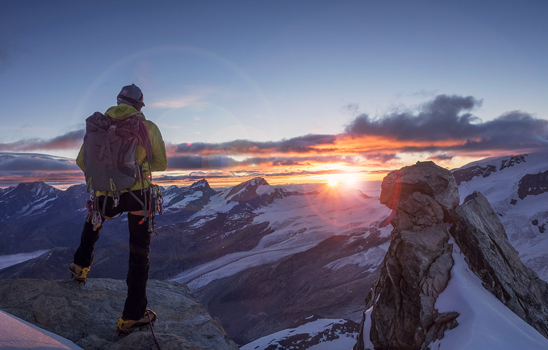 The summit of a mountain at sunset. 
