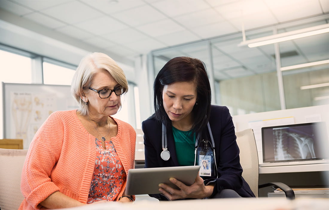 Two women looking at a tablet