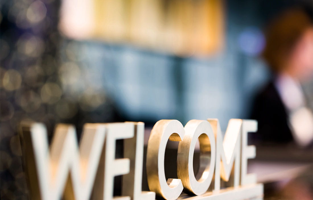 A welcome sign on a desk