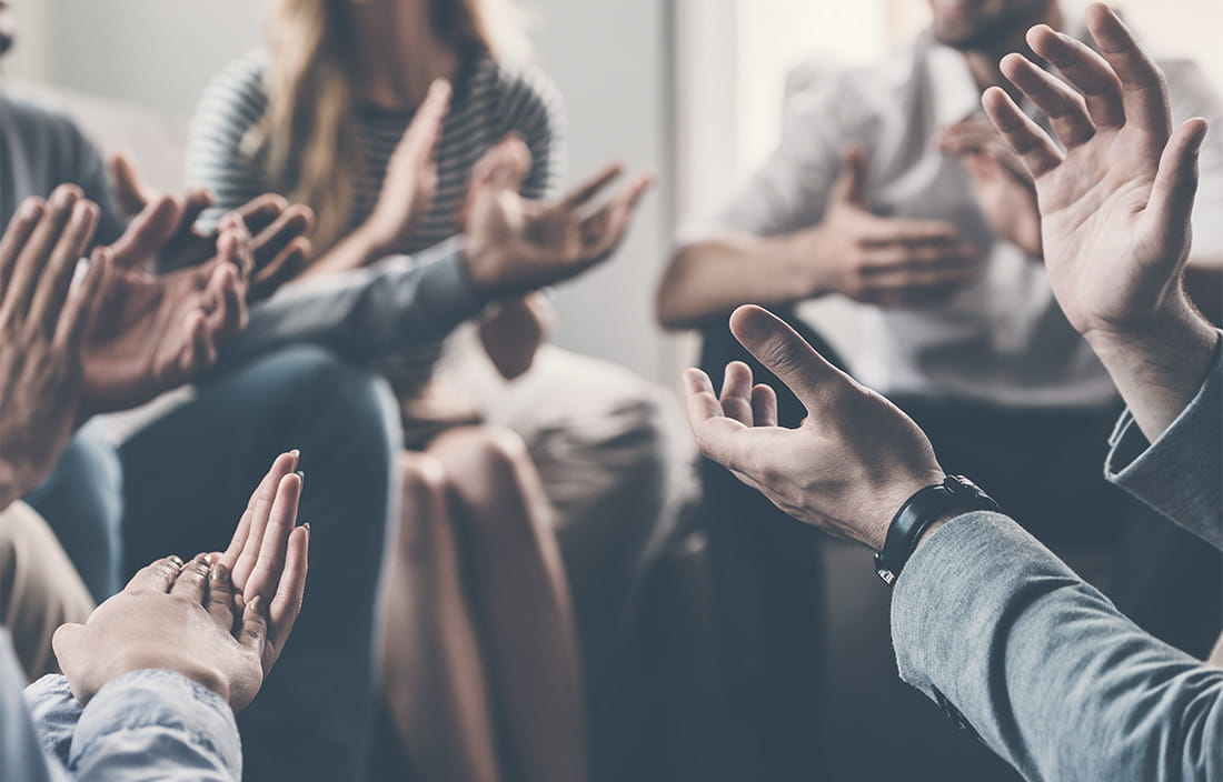 A group of business people applauding