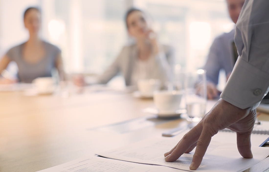 A group of people in a meeting