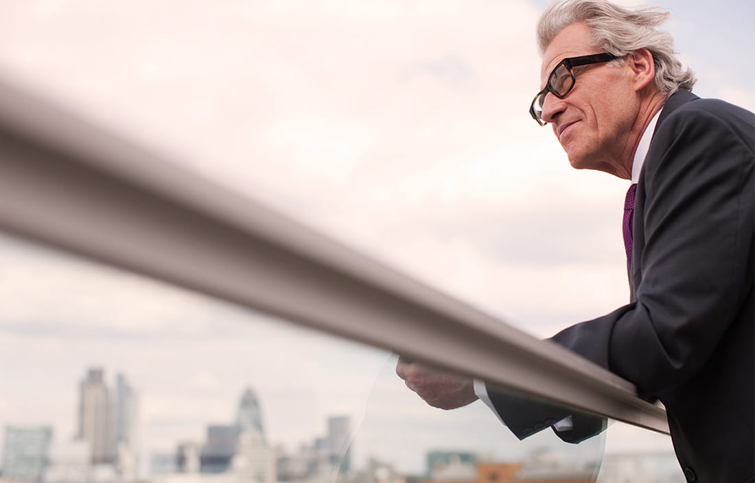 man leaning on rail