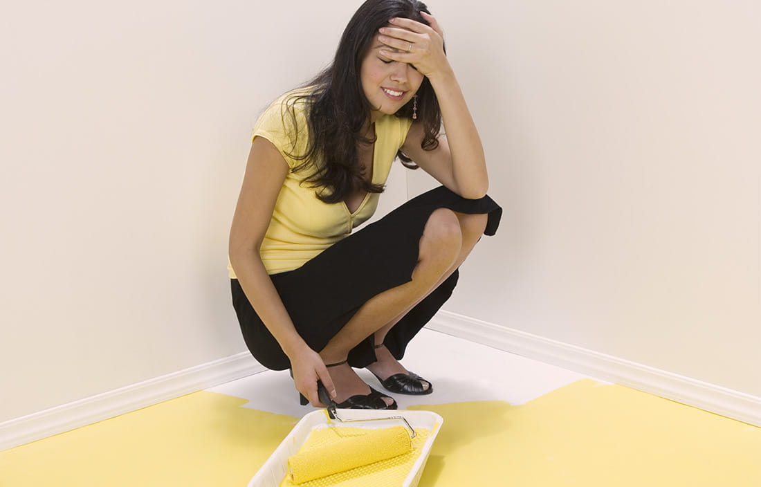 Image of woman painter herself into a corner