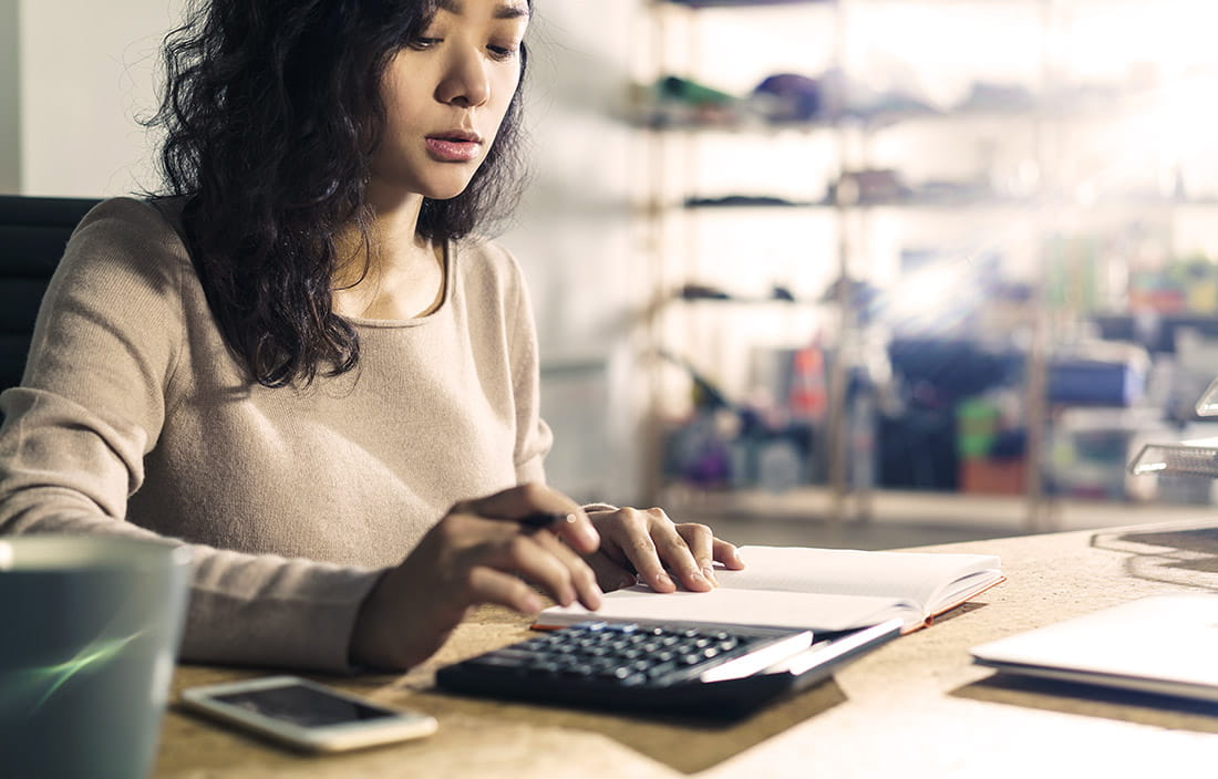 Woman with calculator