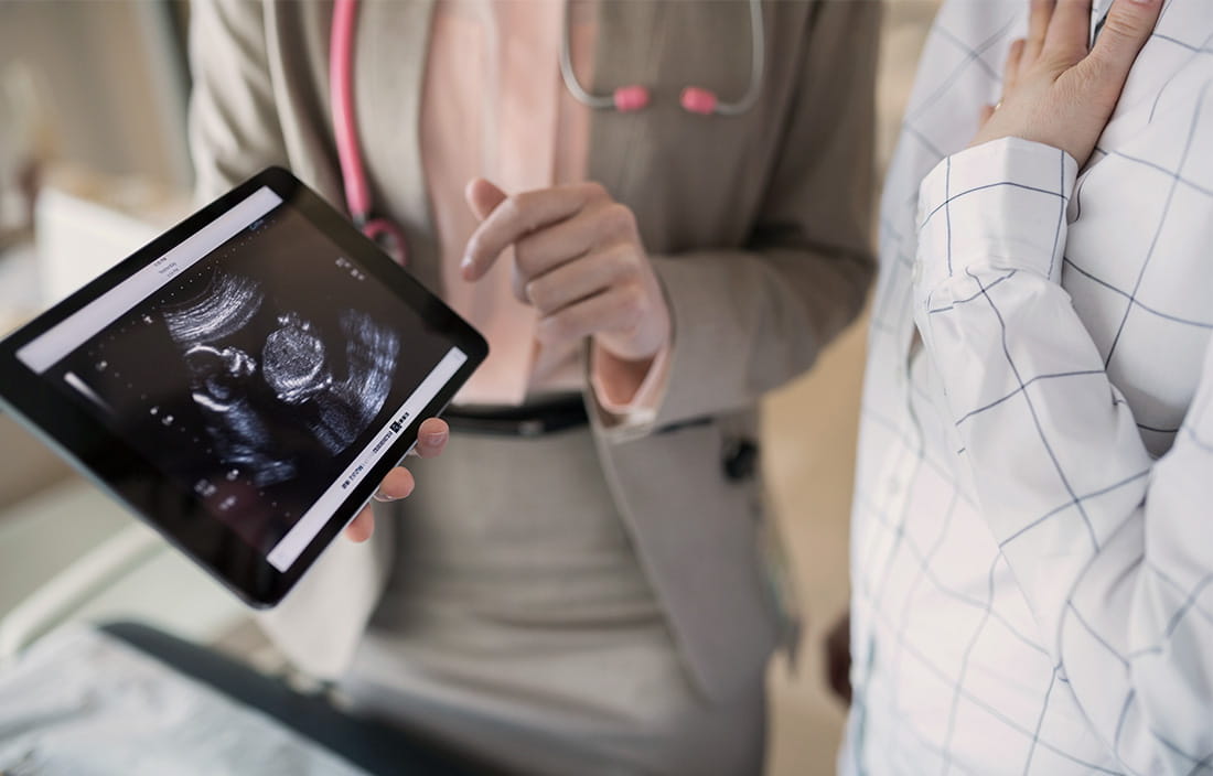 A doctor holding a tablet