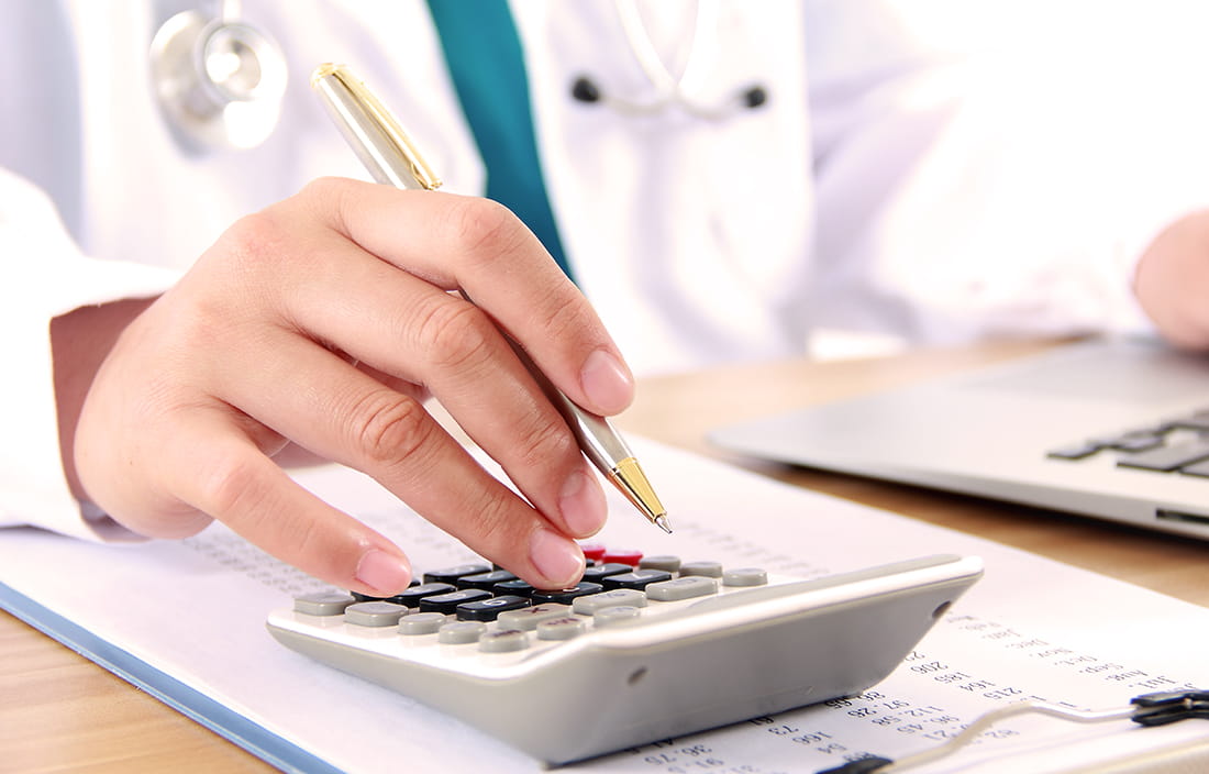 Doctor working on hospital expenditures
