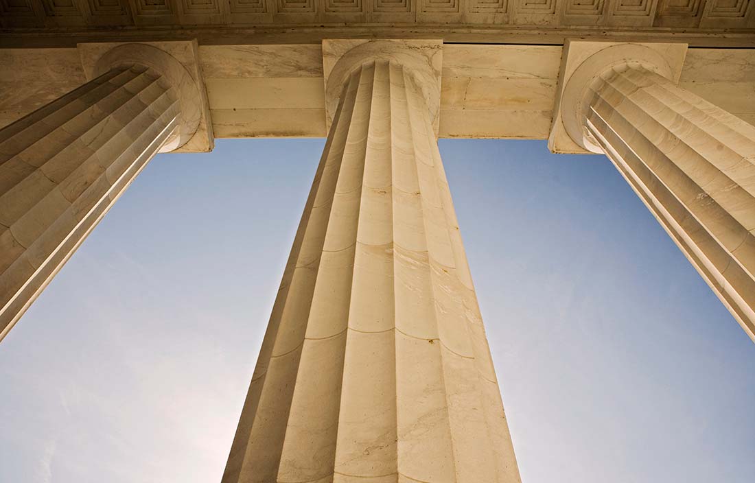 Close up image of a marble column and the sky