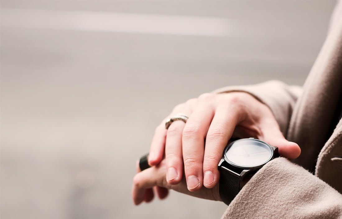 Photo of man checking watch