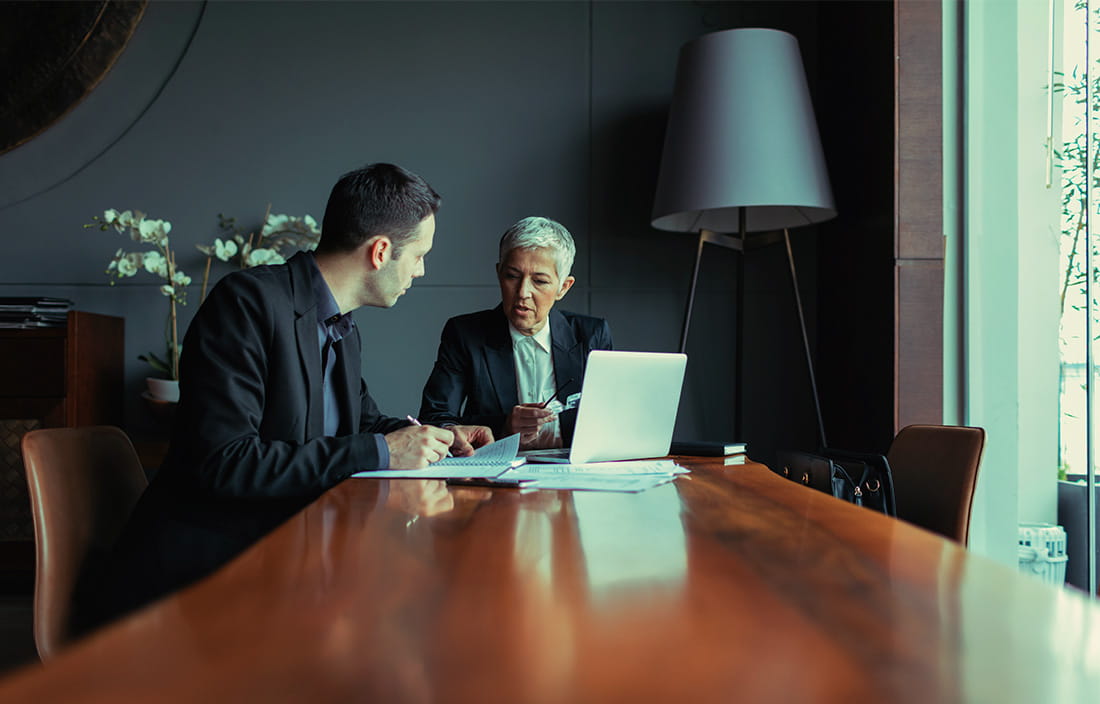 Image of men working in conference room