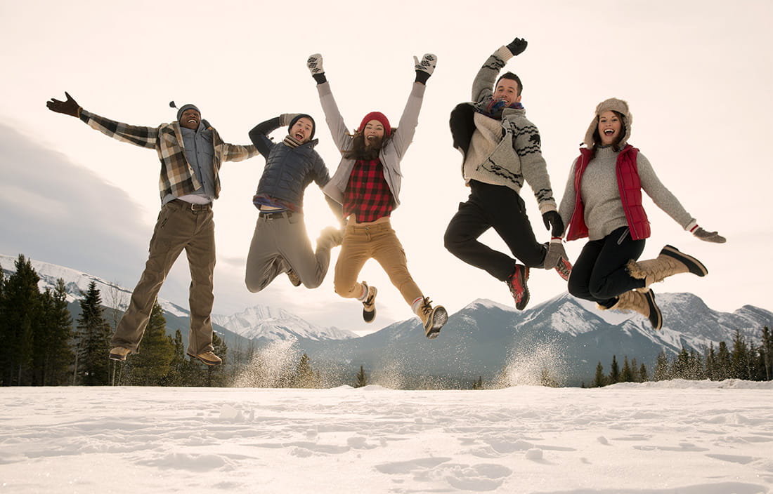 Image of people jumping in snow