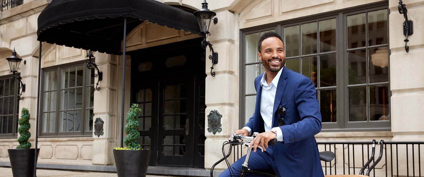 Business man riding a bicycle.