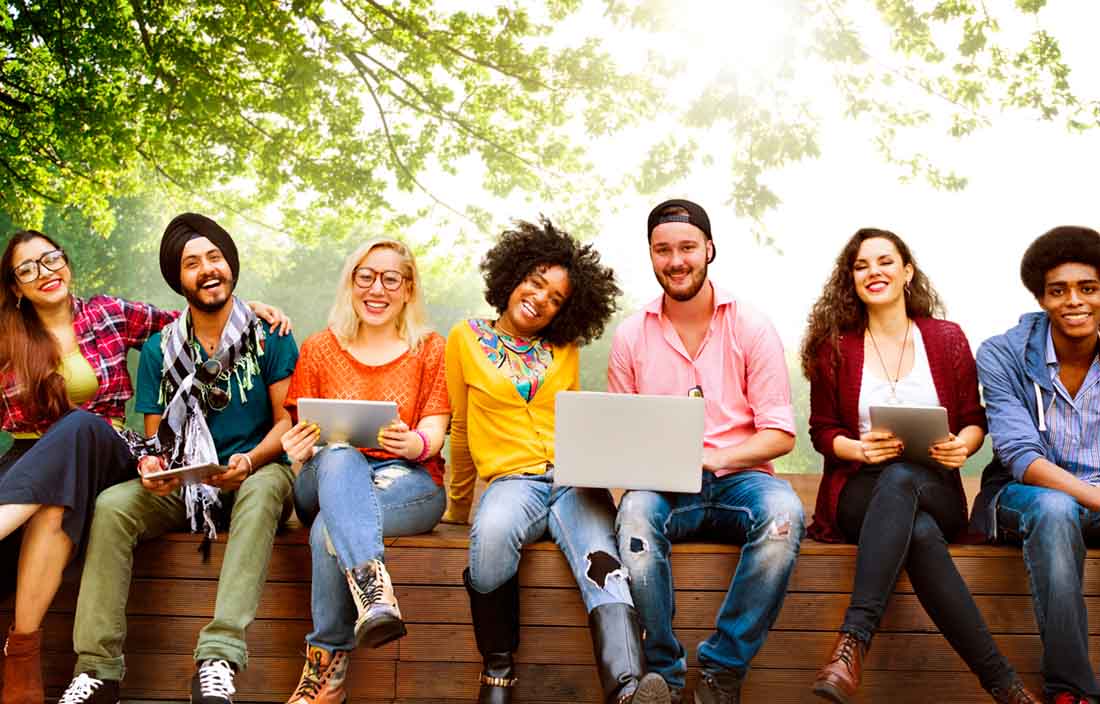 A group photo of young campus recruits smiling.