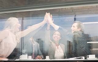 Image of team giving high five