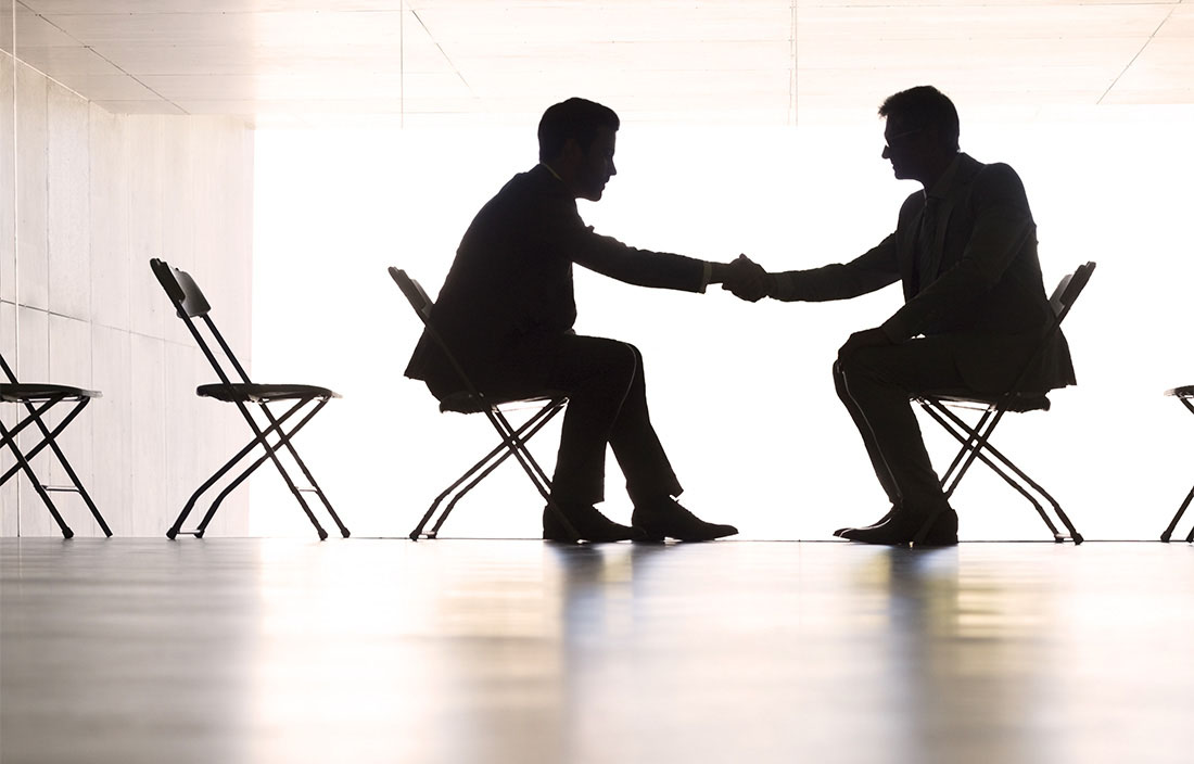 Image of two business men shaking hands