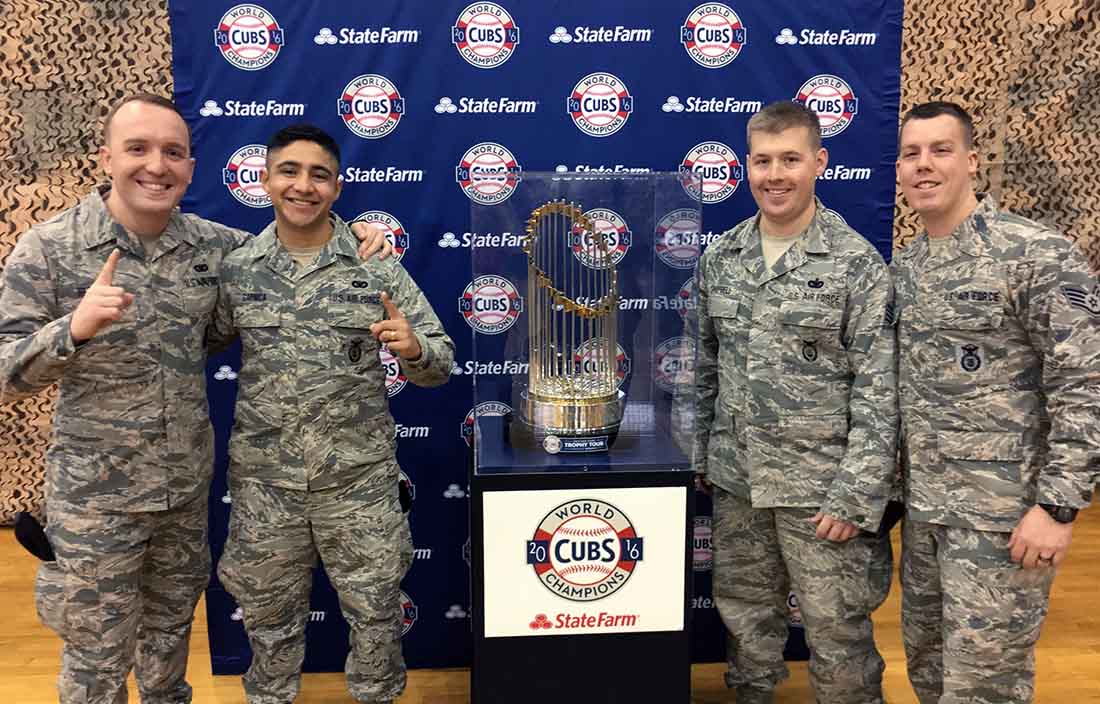 Cody with Cubs World Series trophy