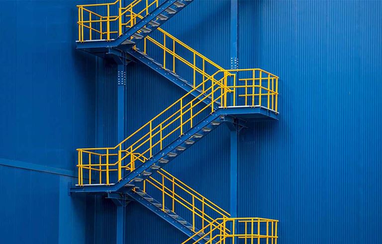 Blue building with yellow stairs