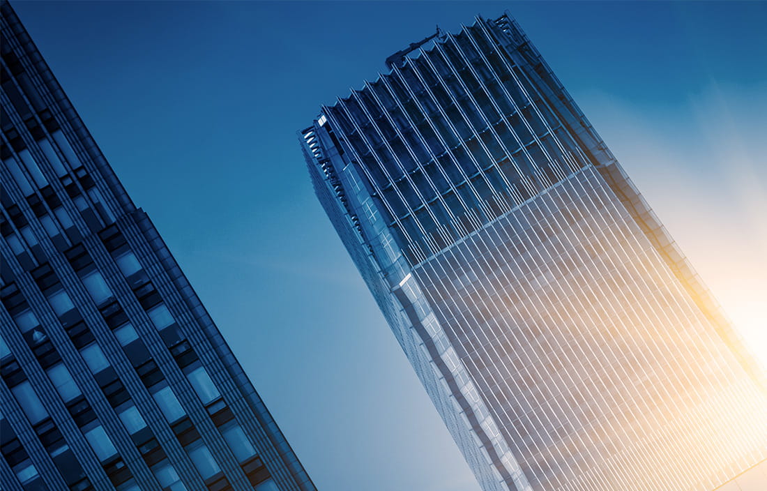 Image of skyscraper with reflection of sun