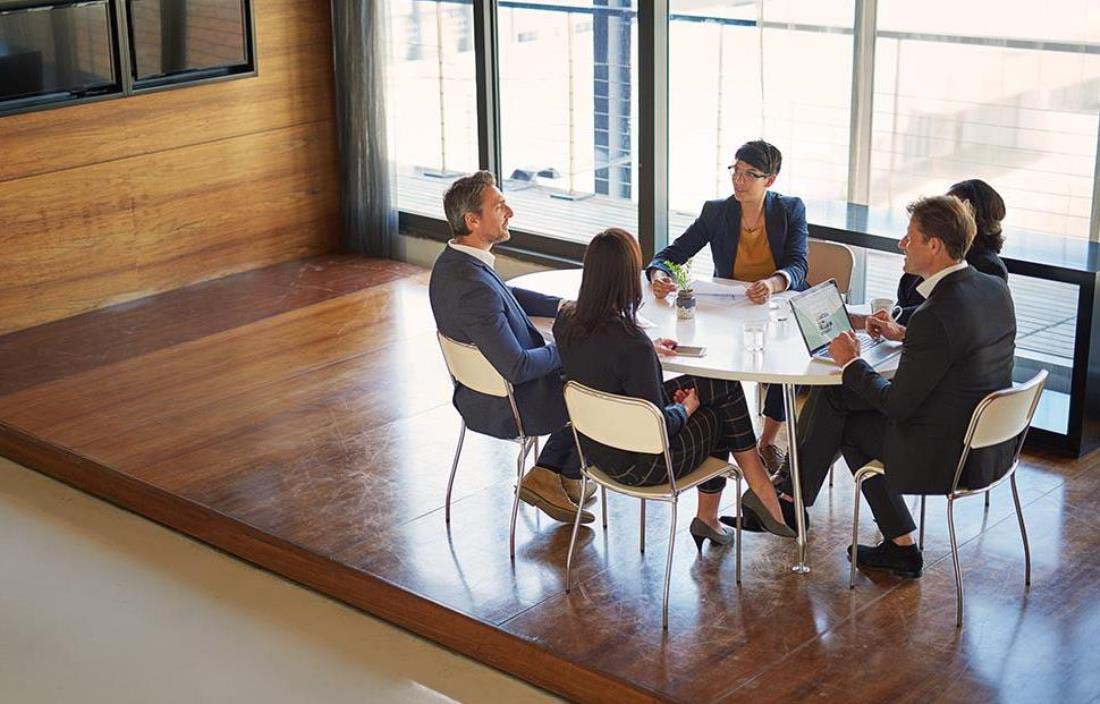 Team members having a meeting at a table
