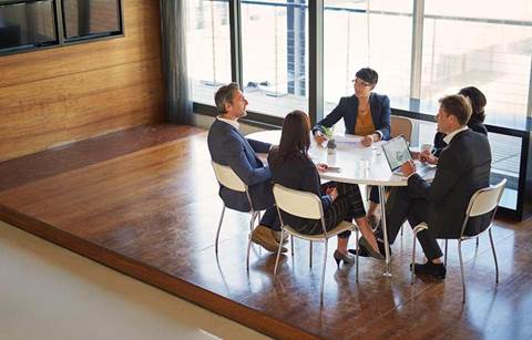 Team members having a meeting at a table