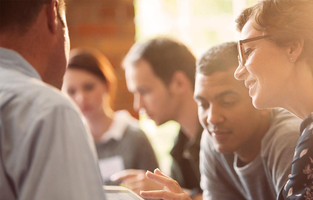 closeup of team members faces when working 