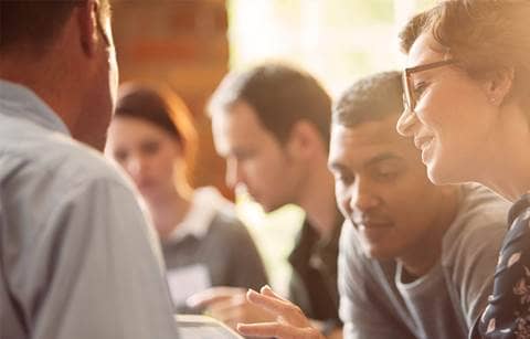 closeup of team members faces when working
