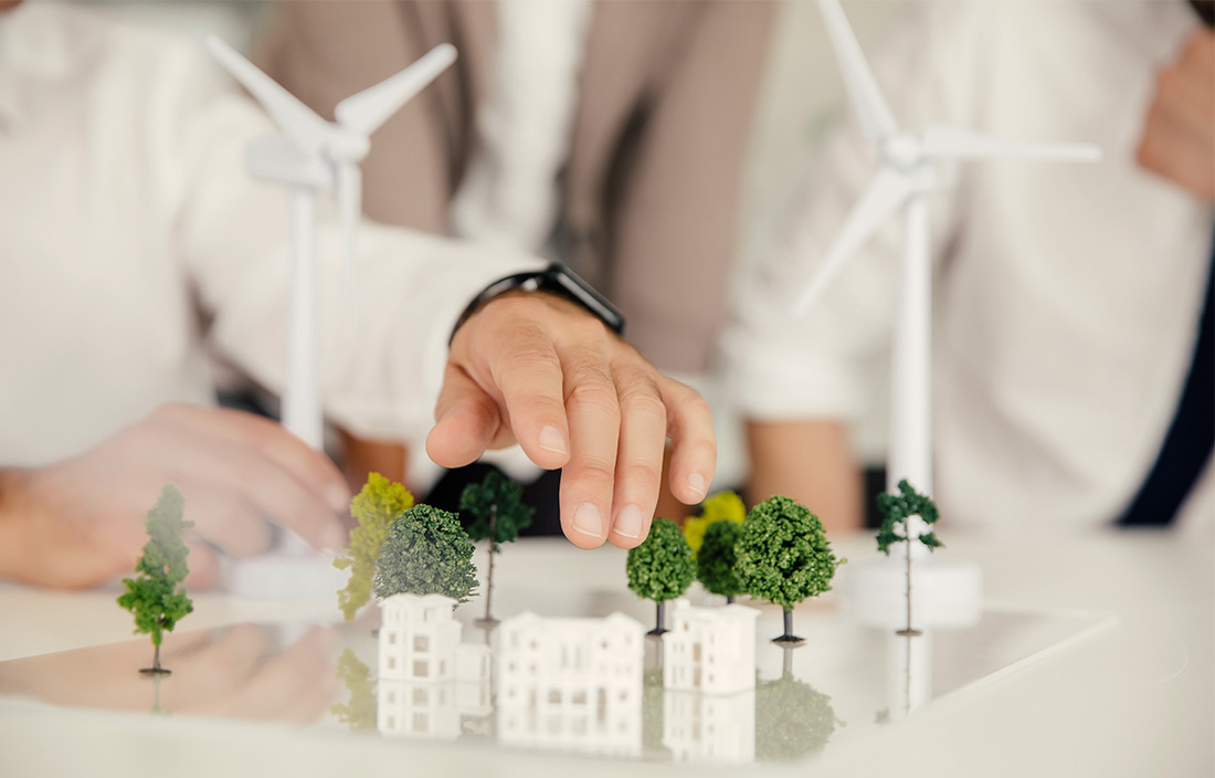 miniature model of a few buildings and trees