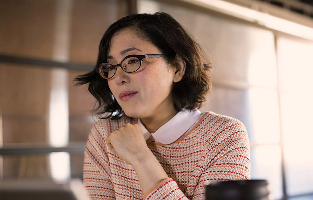 Woman thinking at desk