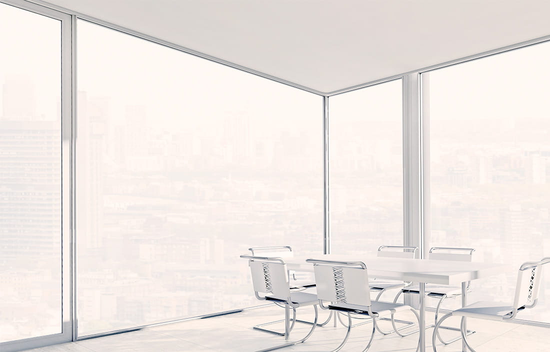 modern corner office board room with windows floor to ceiling