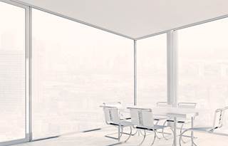 modern corner office board room with windows floor to ceiling