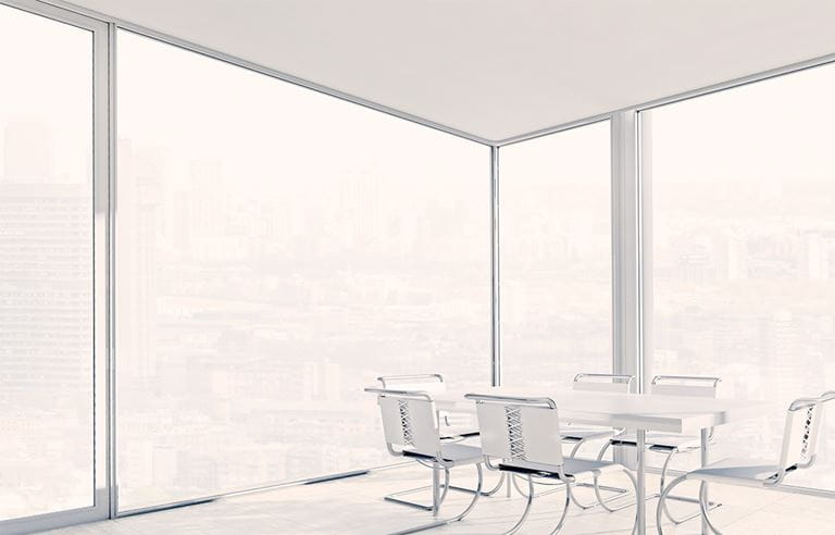 modern corner office board room with windows floor to ceiling