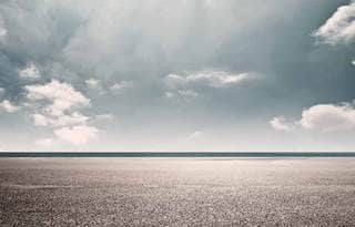 clear scene of road and vibrant blue sky