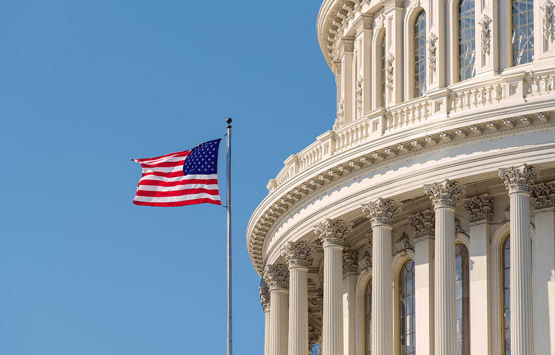 American flag flying in a blue sky