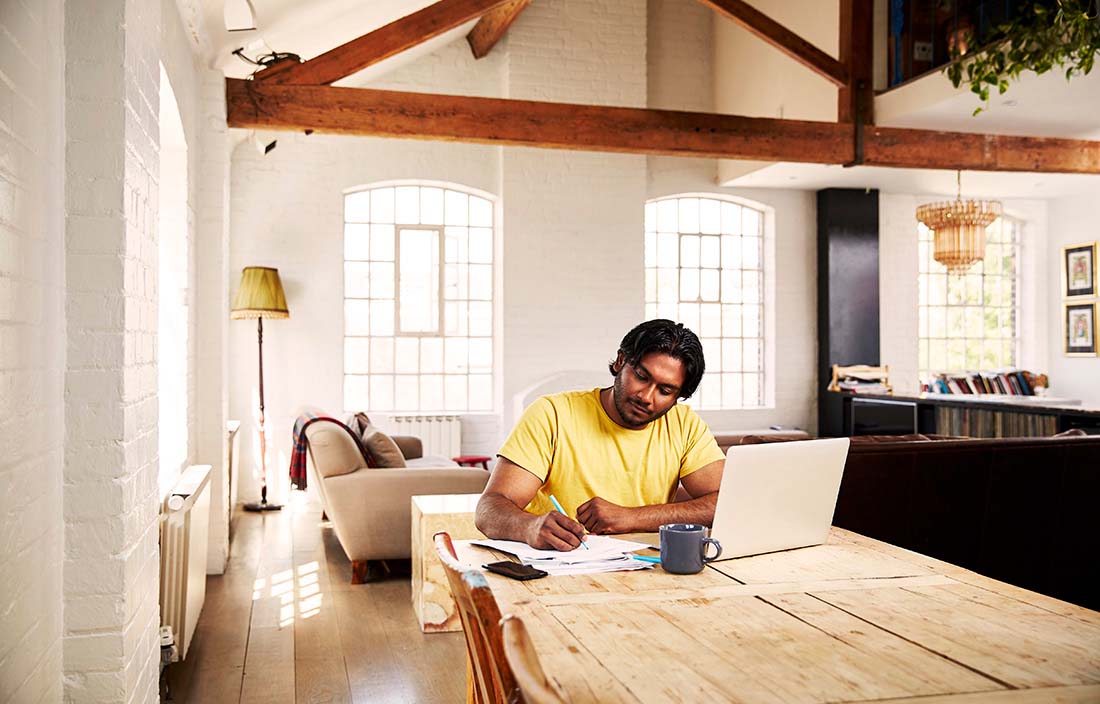 Man working alone in his house