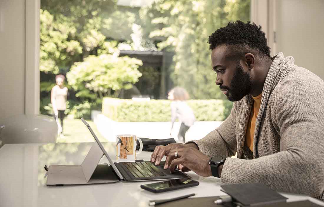 Adult working alone at home office