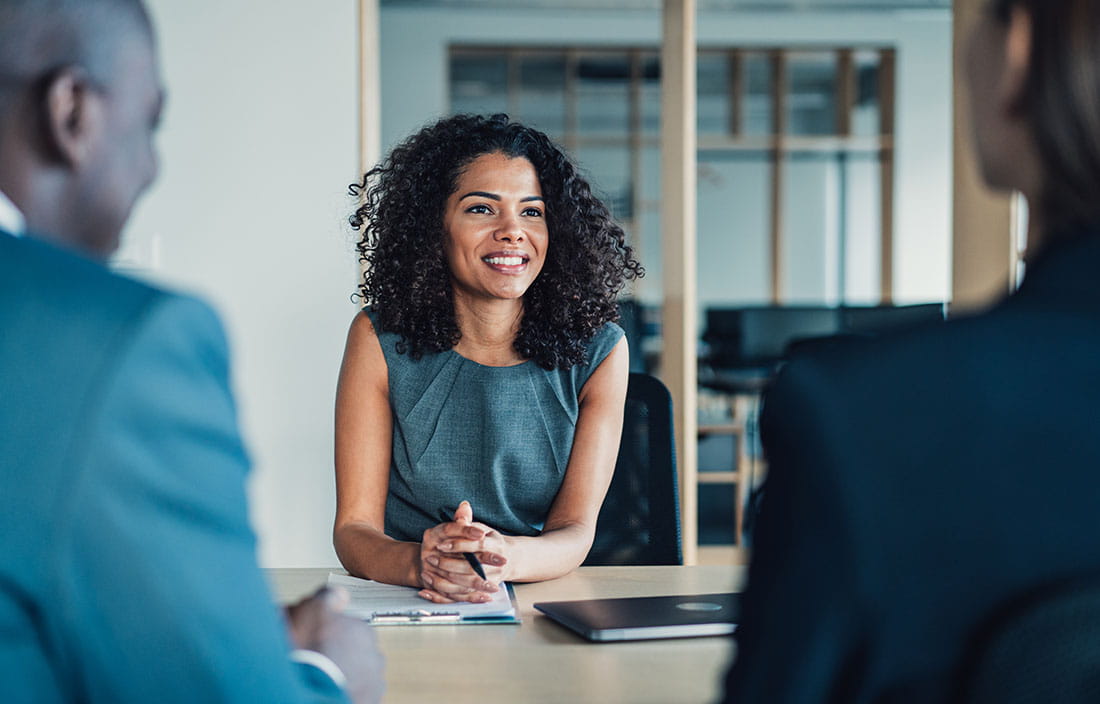 Business professional talking to their clients about risk management.