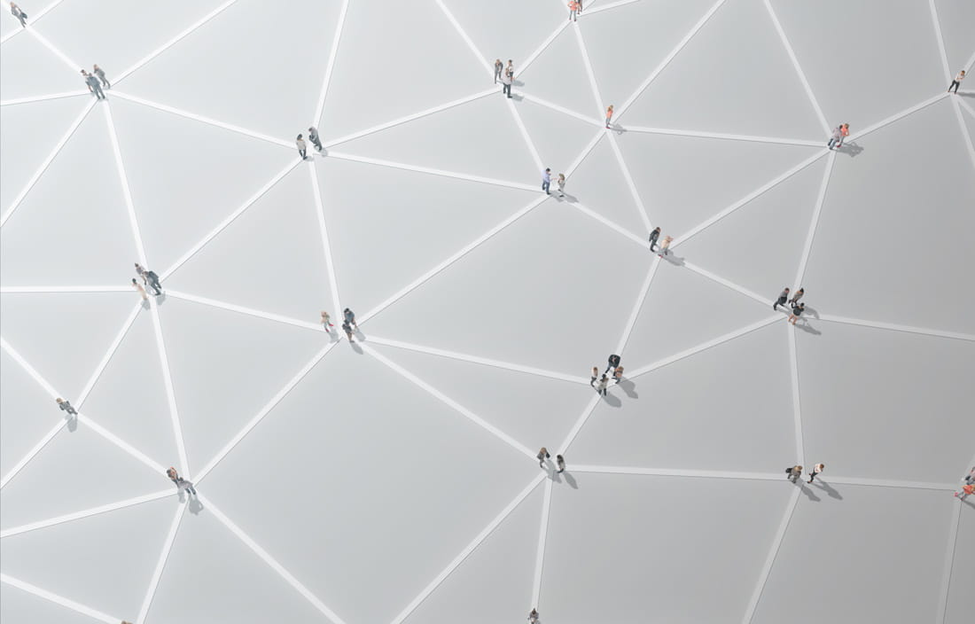 Aerial view of interconnected network of people against a white background.