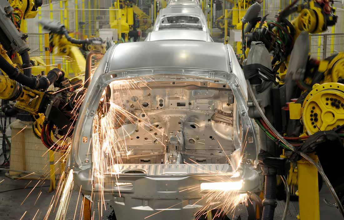 Automobile being built in a factory.