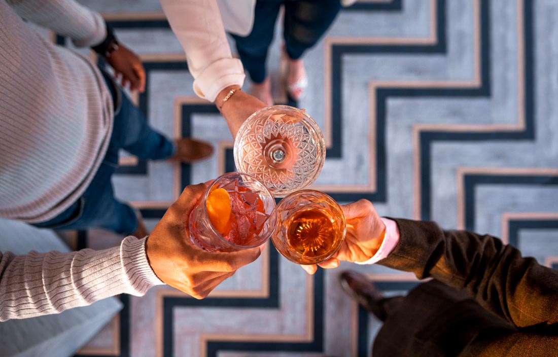 Group of friends clinking their glasses.