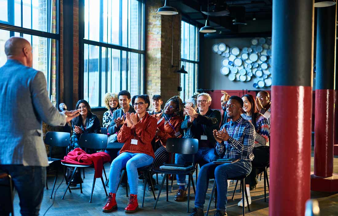 Group of business professionals attending an in-person event.